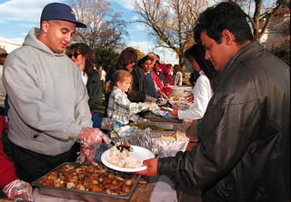 Summitville residents serve food at a fundraiser for CEC MidCorp.